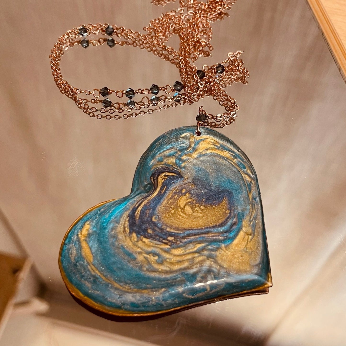 Copper necklace with square pendant, embellished with amethyst pearl.