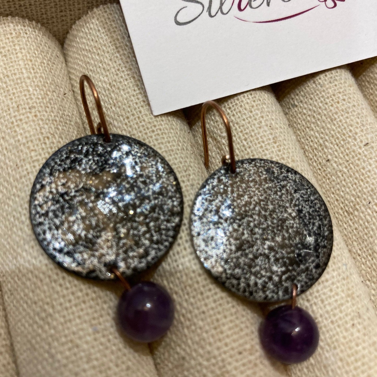 Antiqued copper earrings, hammered effect, with amethyst pearl.