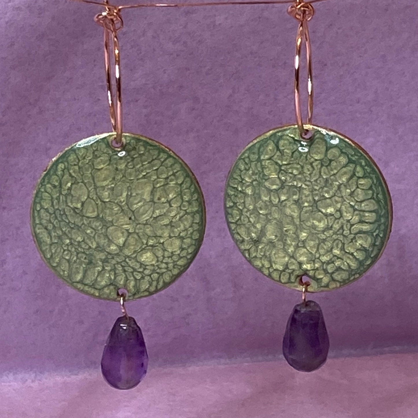 Copper pendant earrings embellished with amethyst drops.