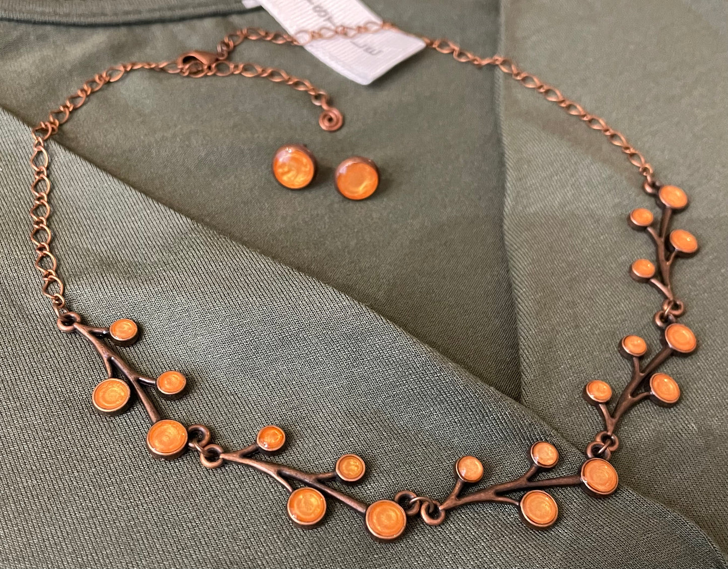 Red copper necklace with floral motifs