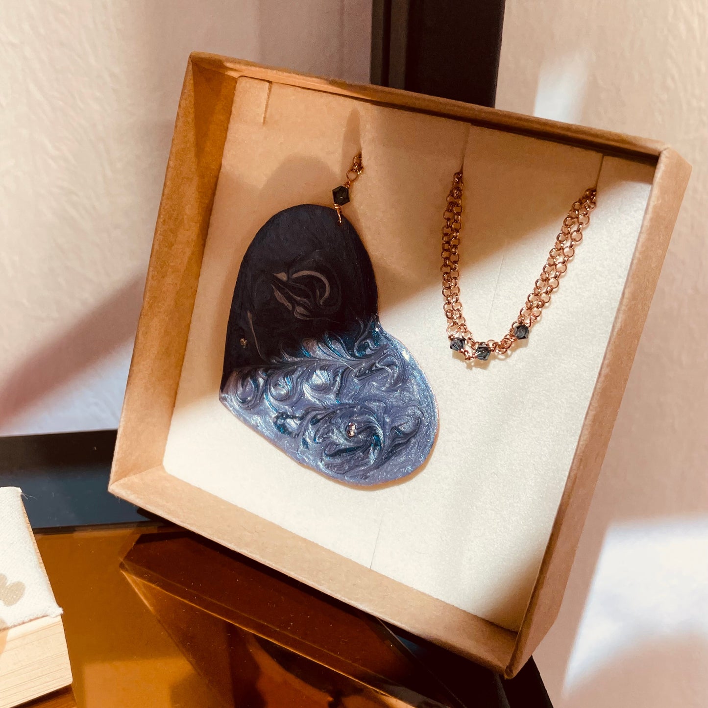 Copper necklace with square pendant, embellished with amethyst pearl.