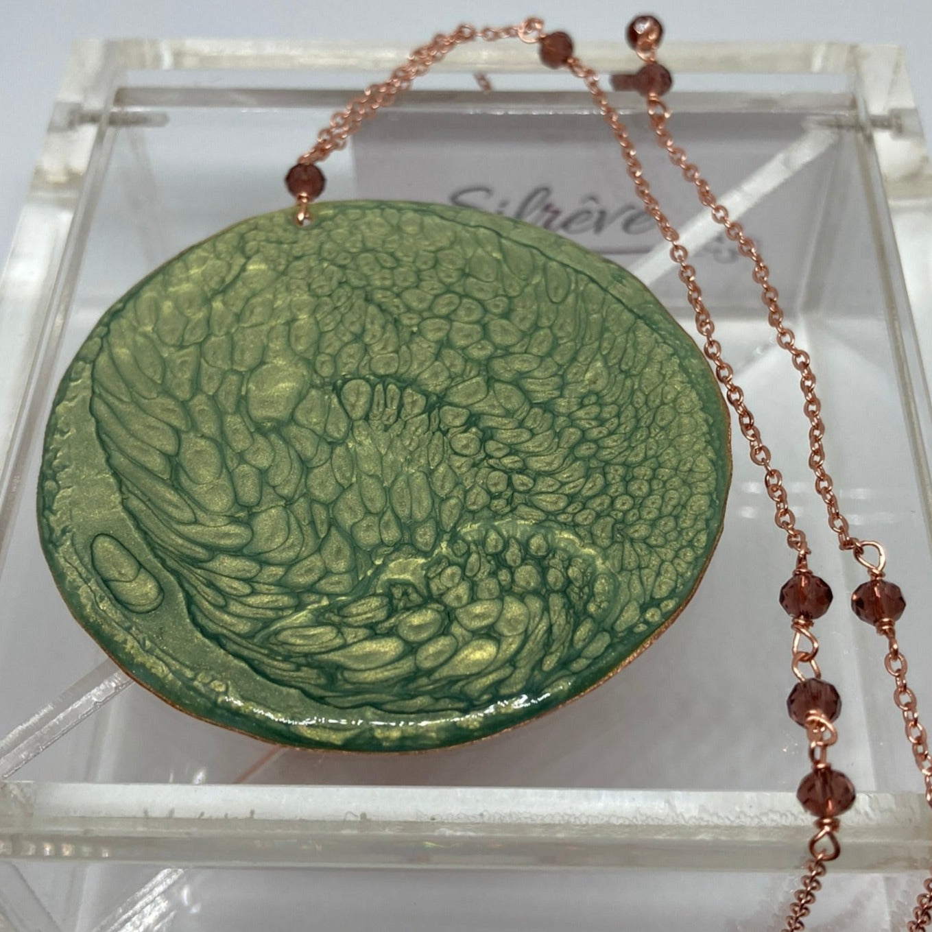 Copper necklace with square pendant, embellished with amethyst pearl.