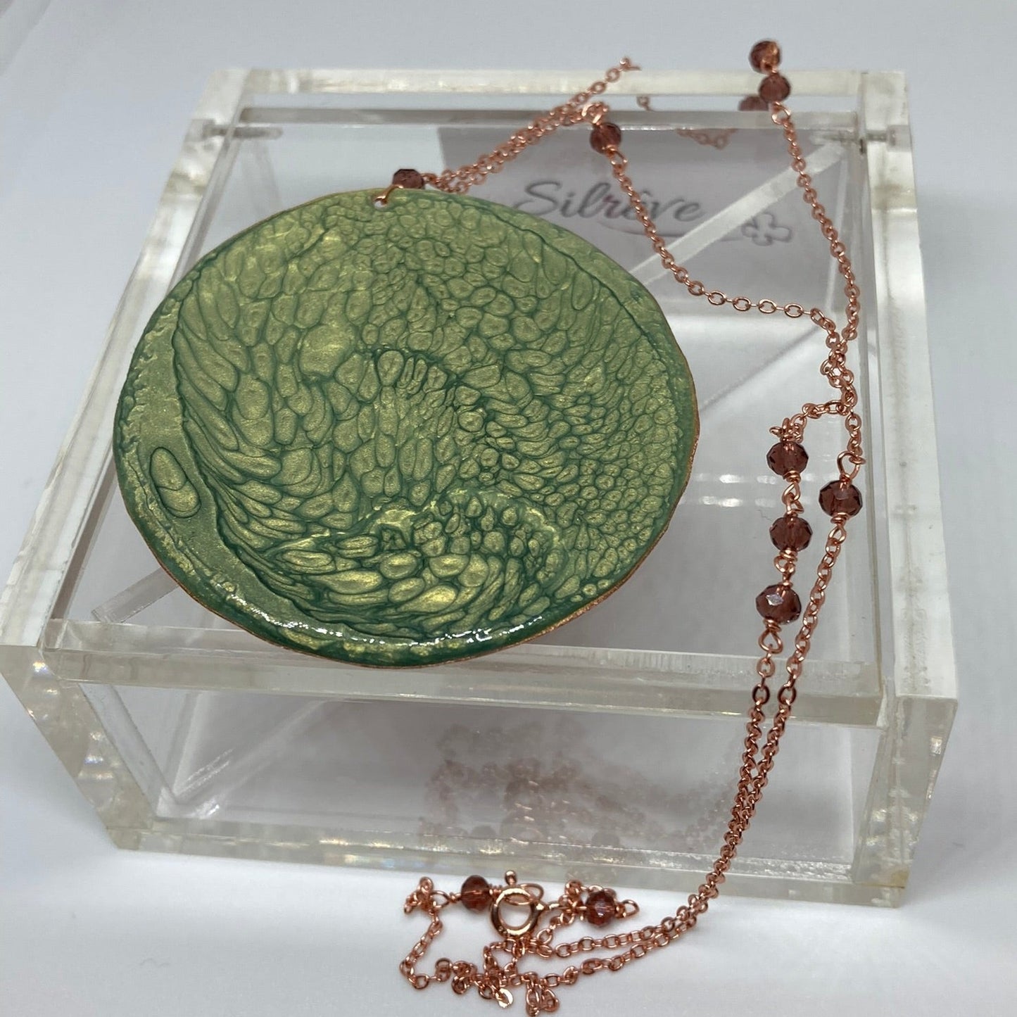 Copper necklace with square pendant, embellished with amethyst pearl.