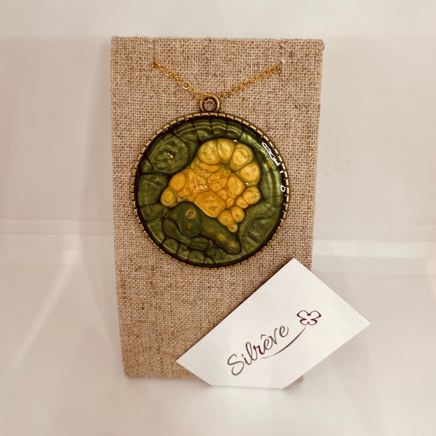 Bronze necklace with hand painted and vitrified round pendant.