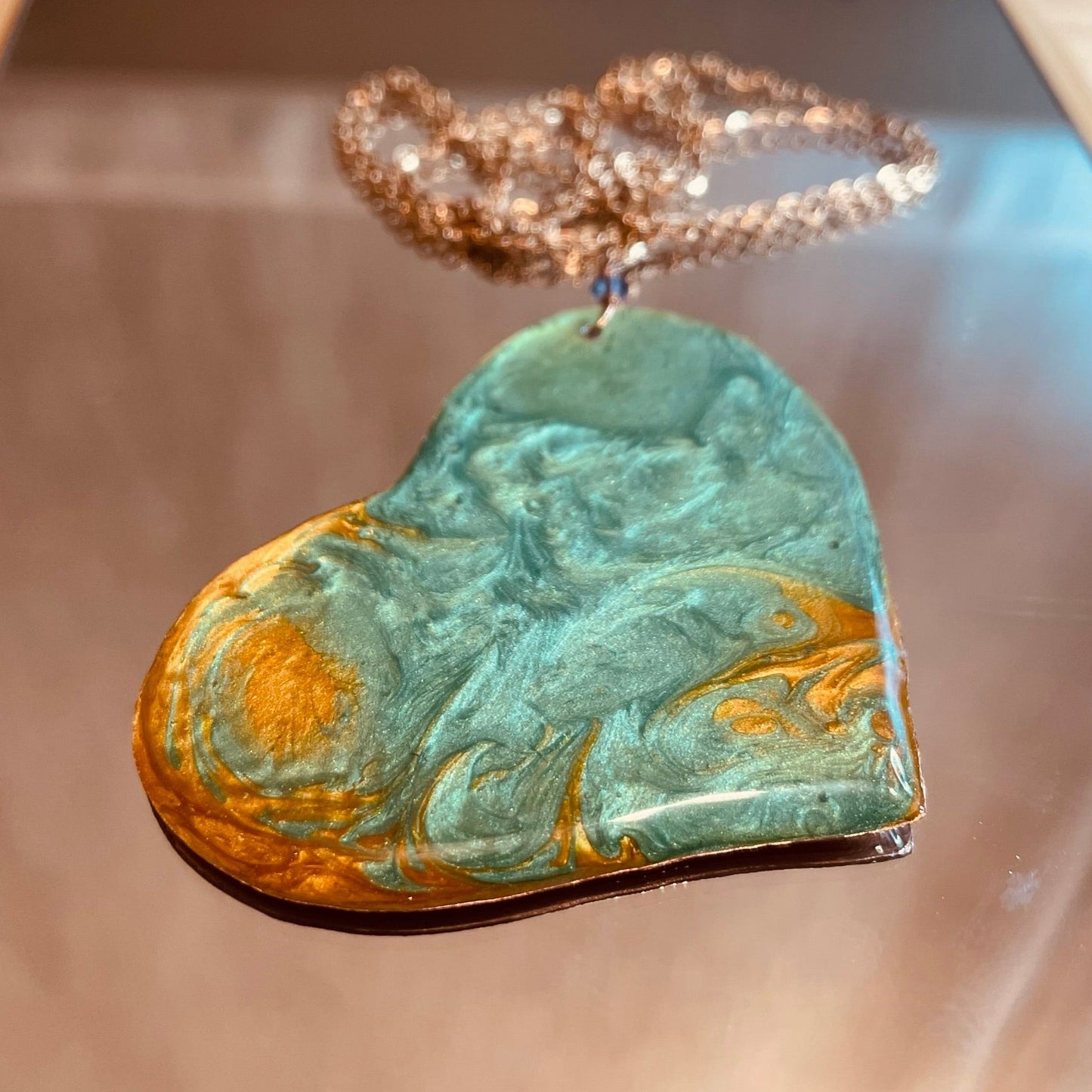 Copper necklace with square pendant, embellished with amethyst pearl.