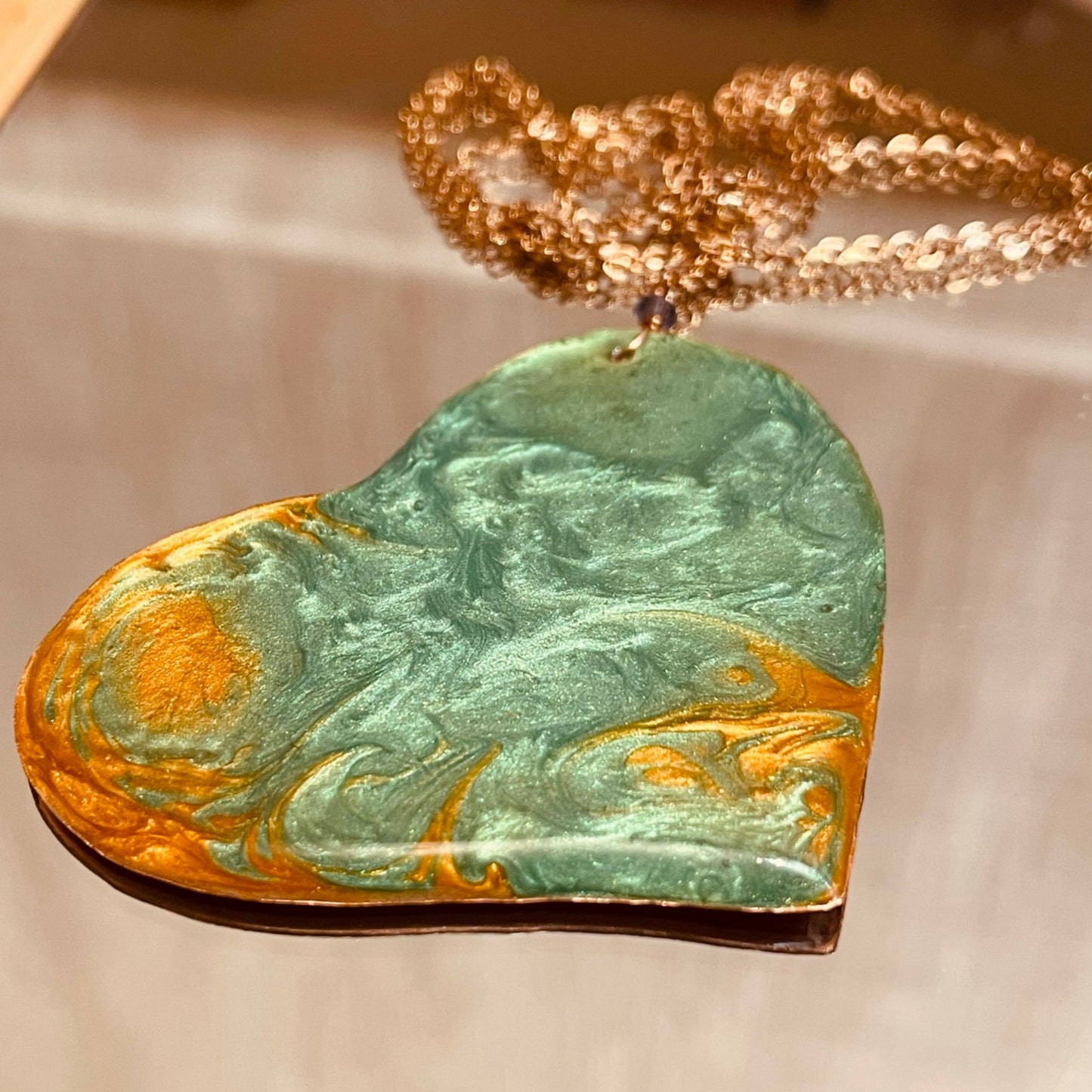 Copper necklace with square pendant, embellished with amethyst pearl.