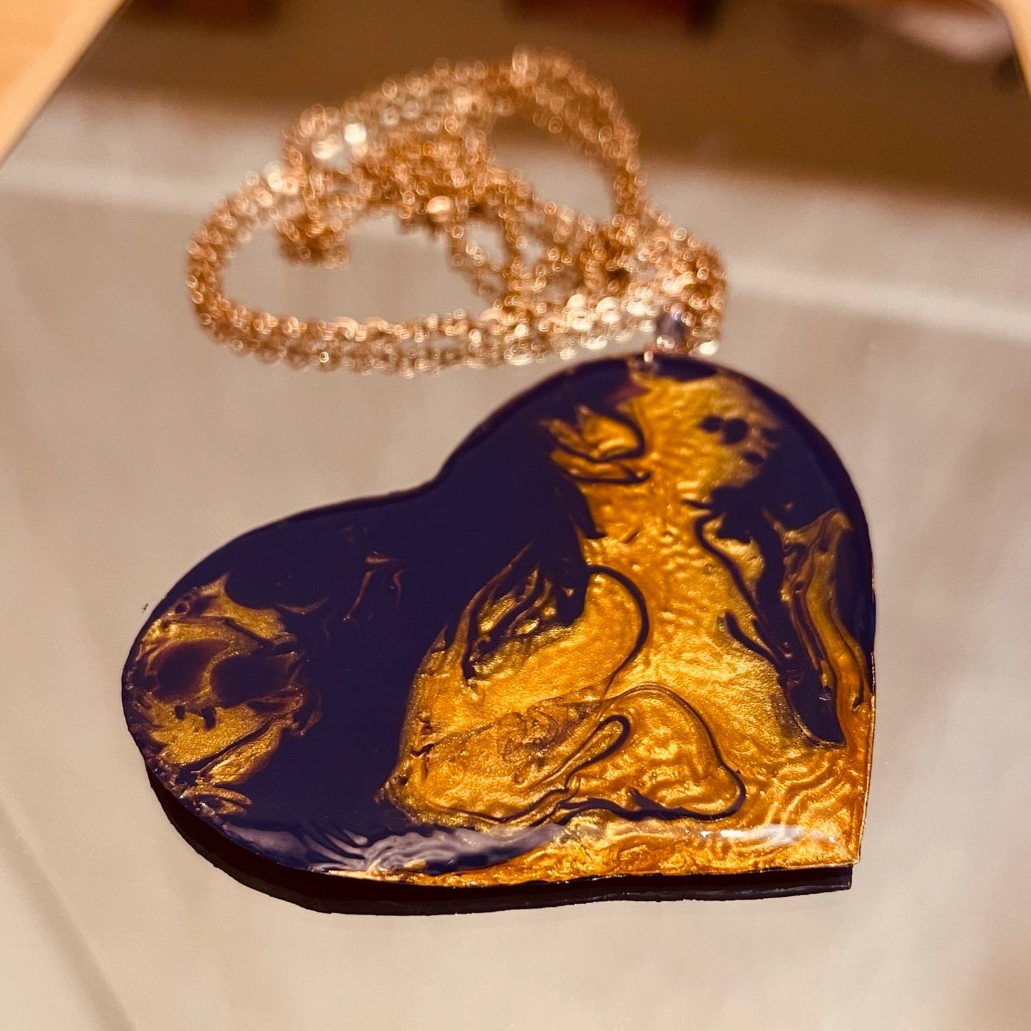 Copper necklace with square pendant, embellished with amethyst pearl.