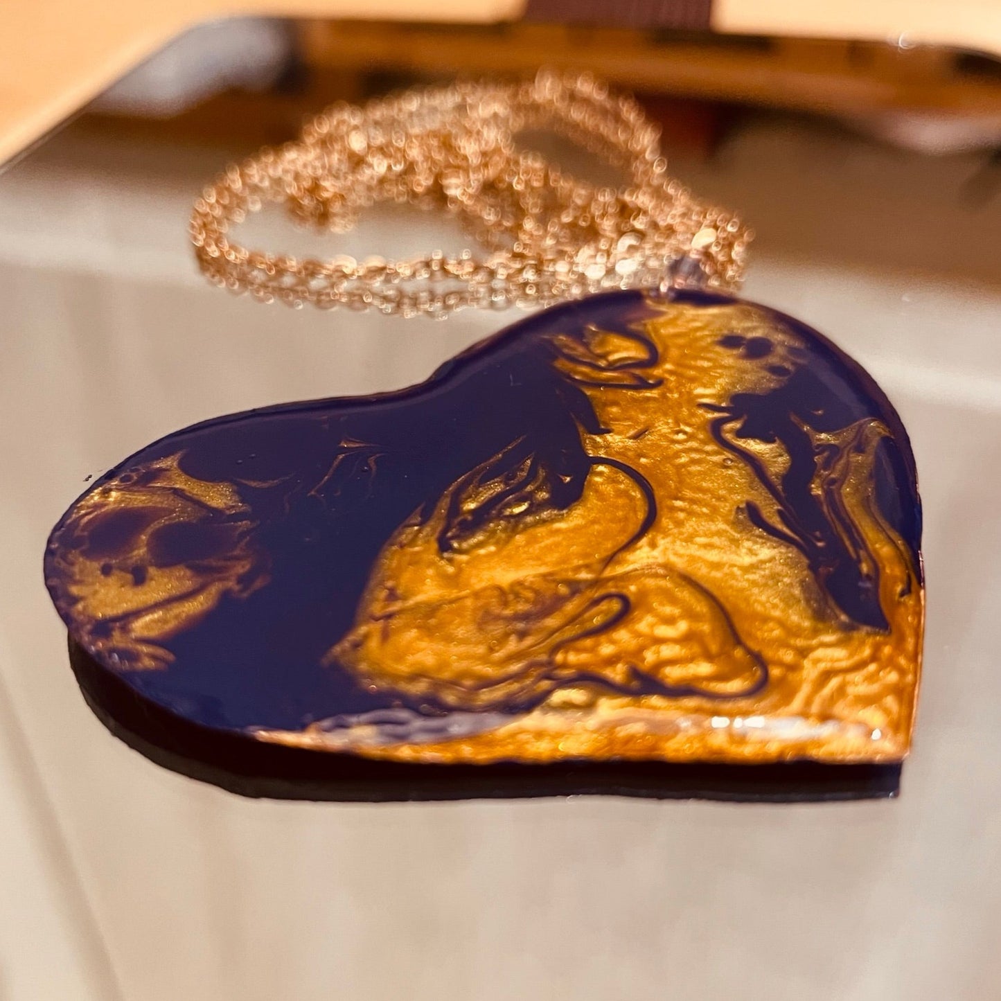 Copper necklace with square pendant, embellished with amethyst pearl.