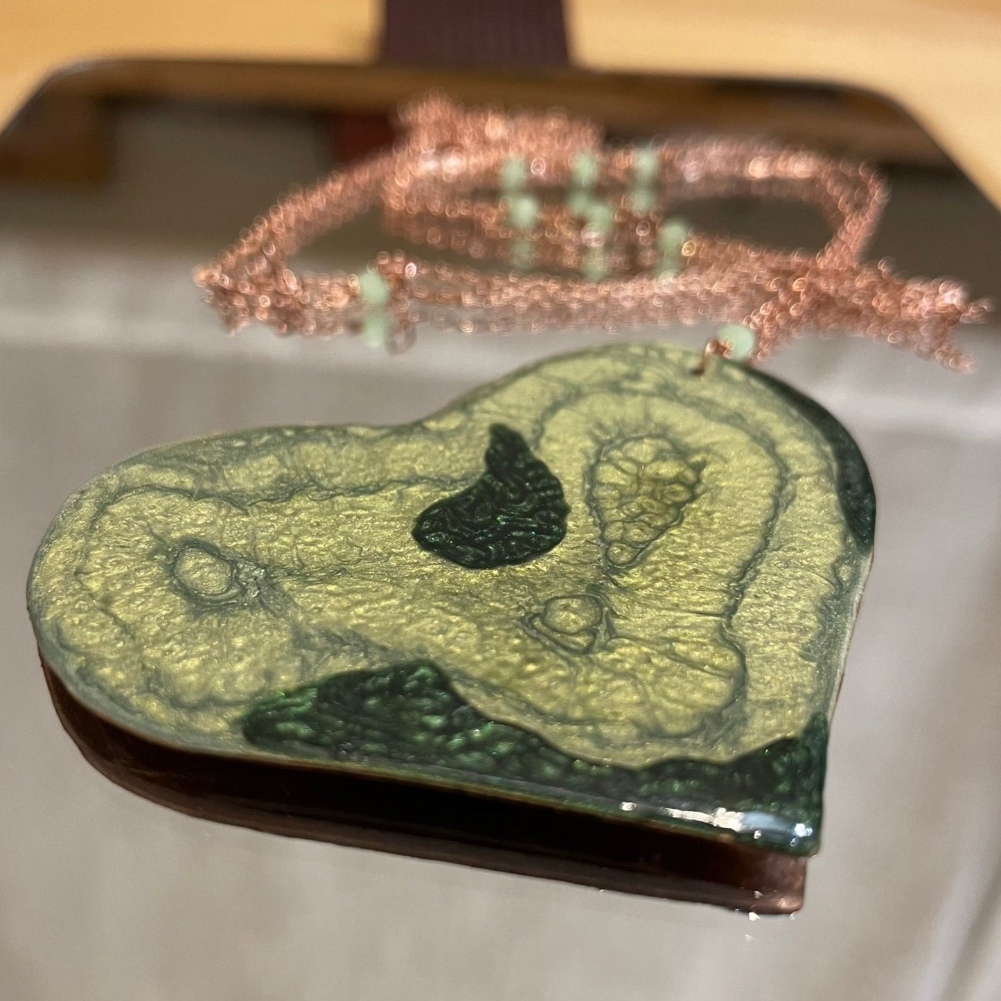 Copper necklace with square pendant, embellished with amethyst pearl.