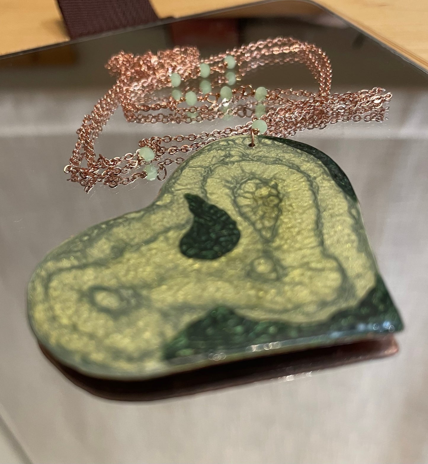 Copper necklace with square pendant, embellished with amethyst pearl.