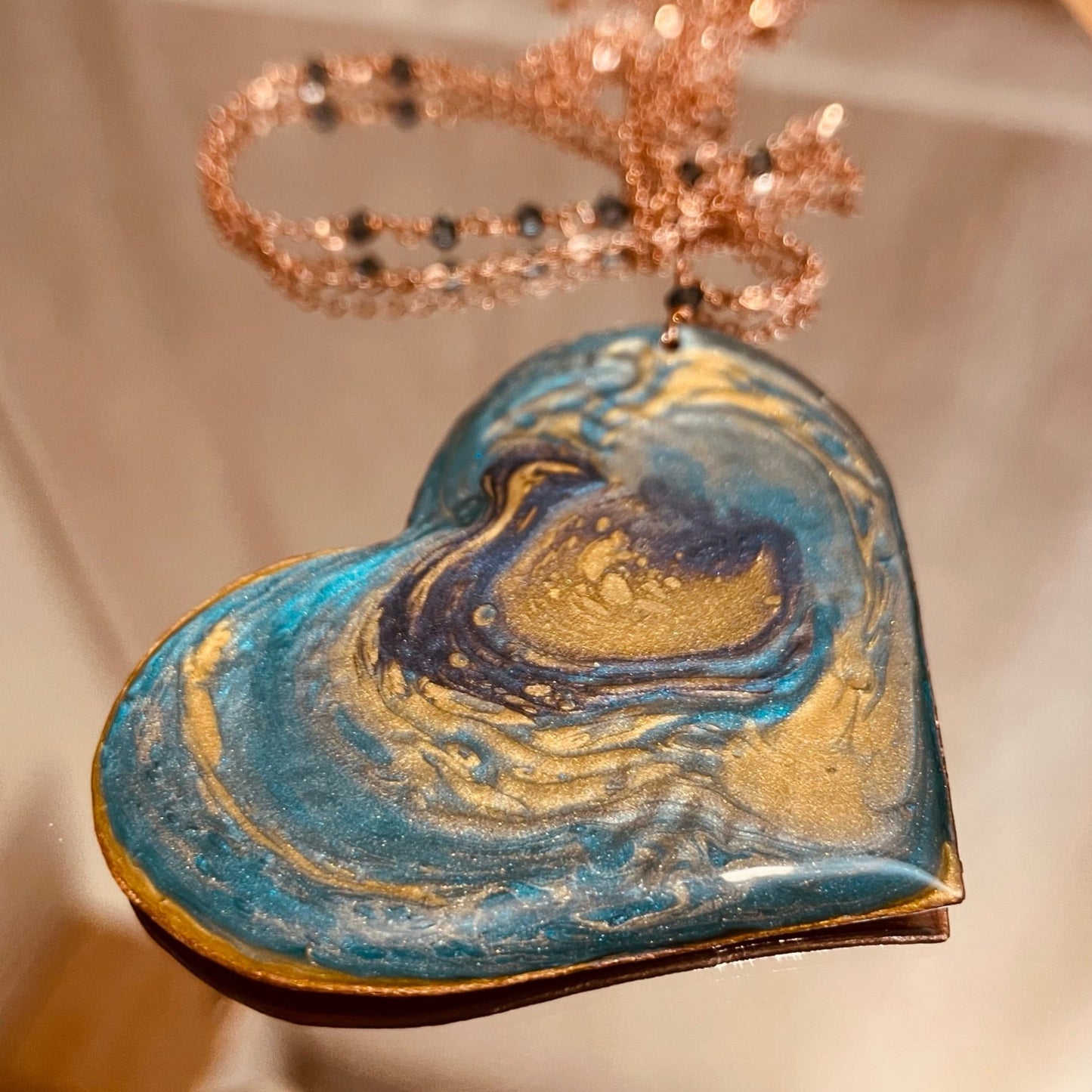 Copper necklace with square pendant, embellished with amethyst pearl.