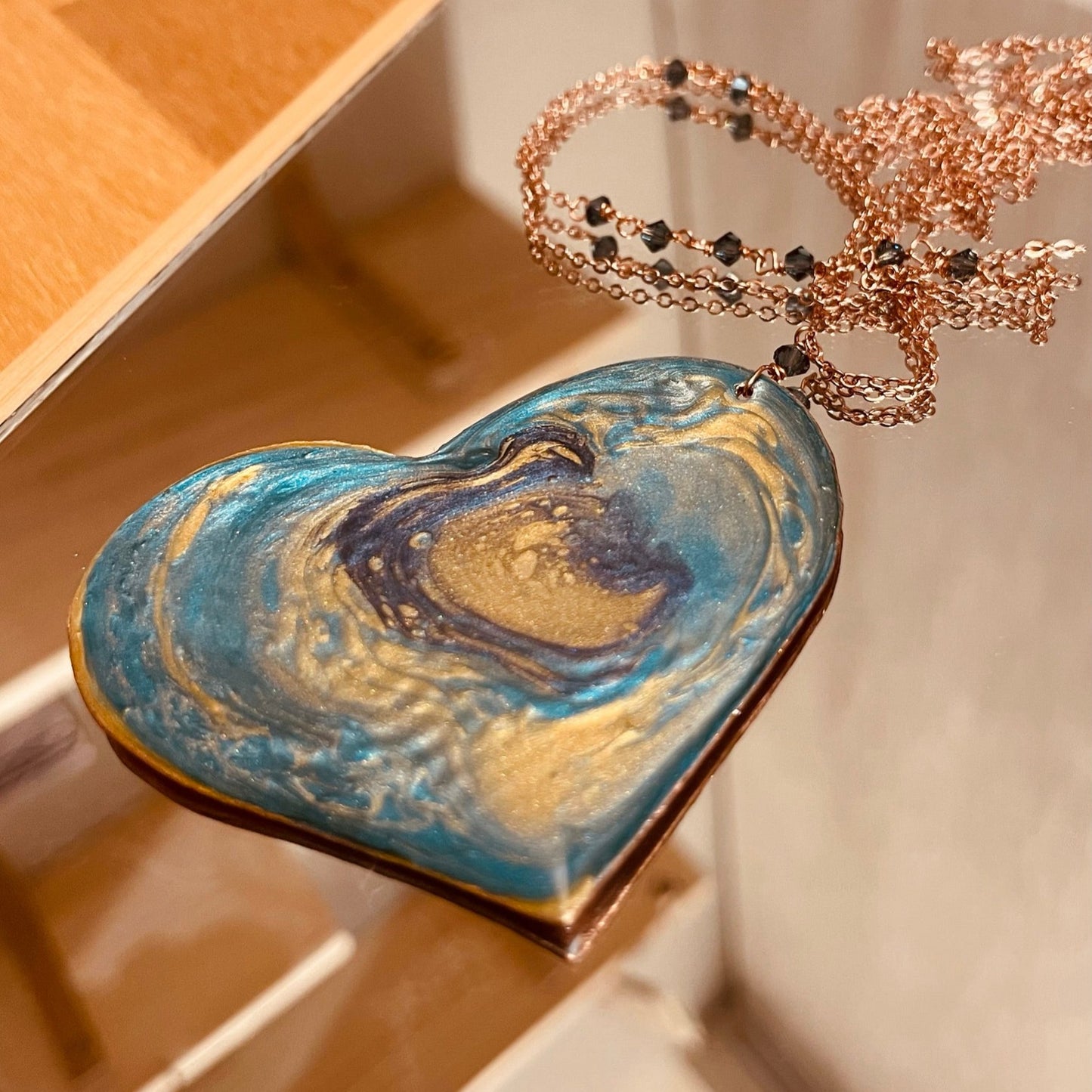 Copper necklace with square pendant, embellished with amethyst pearl.