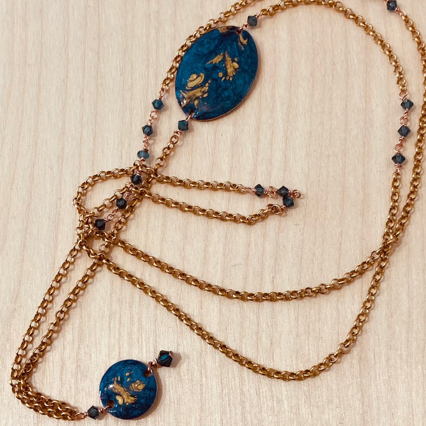 Copper necklace with hand painted and vitrified oval pendant.