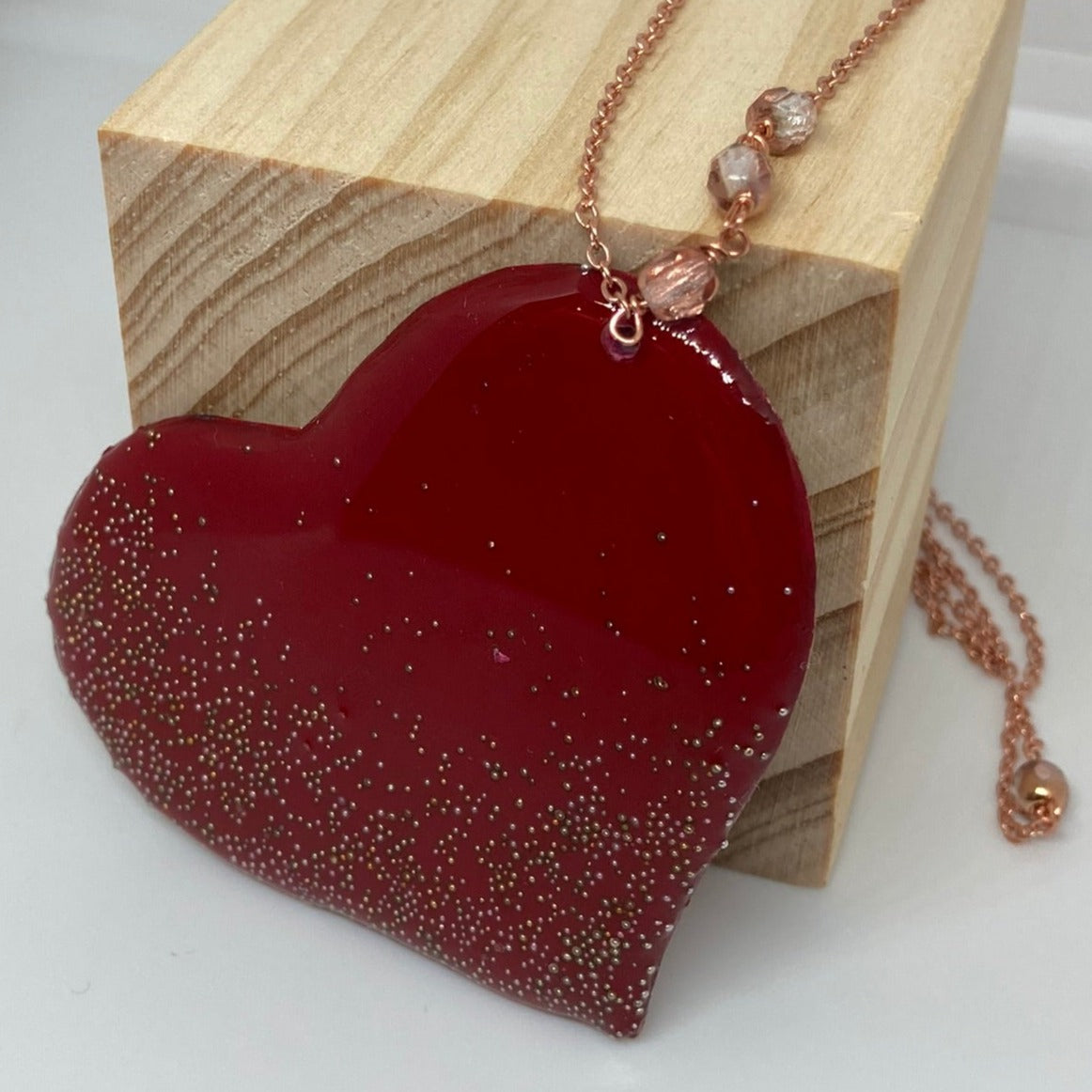 Copper necklace with square pendant, embellished with amethyst pearl.