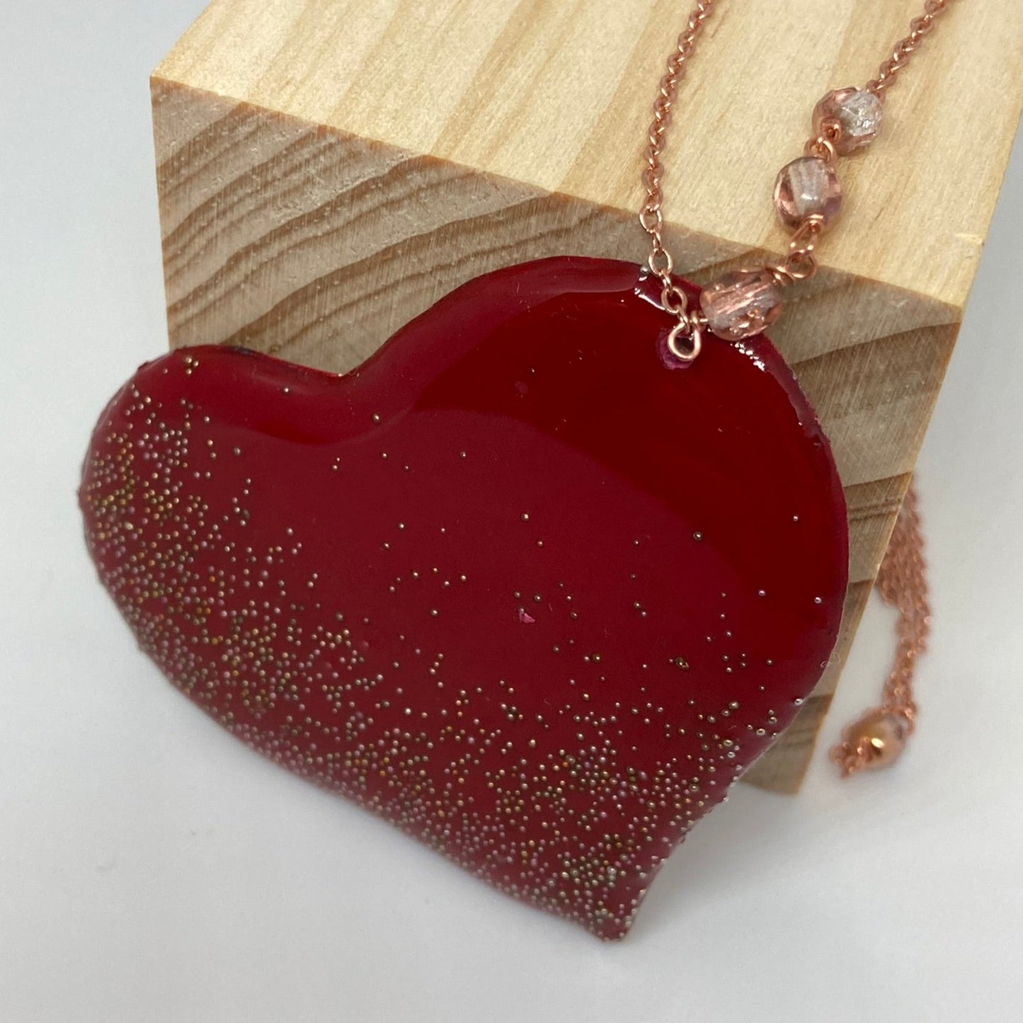 Copper necklace with square pendant, embellished with amethyst pearl.