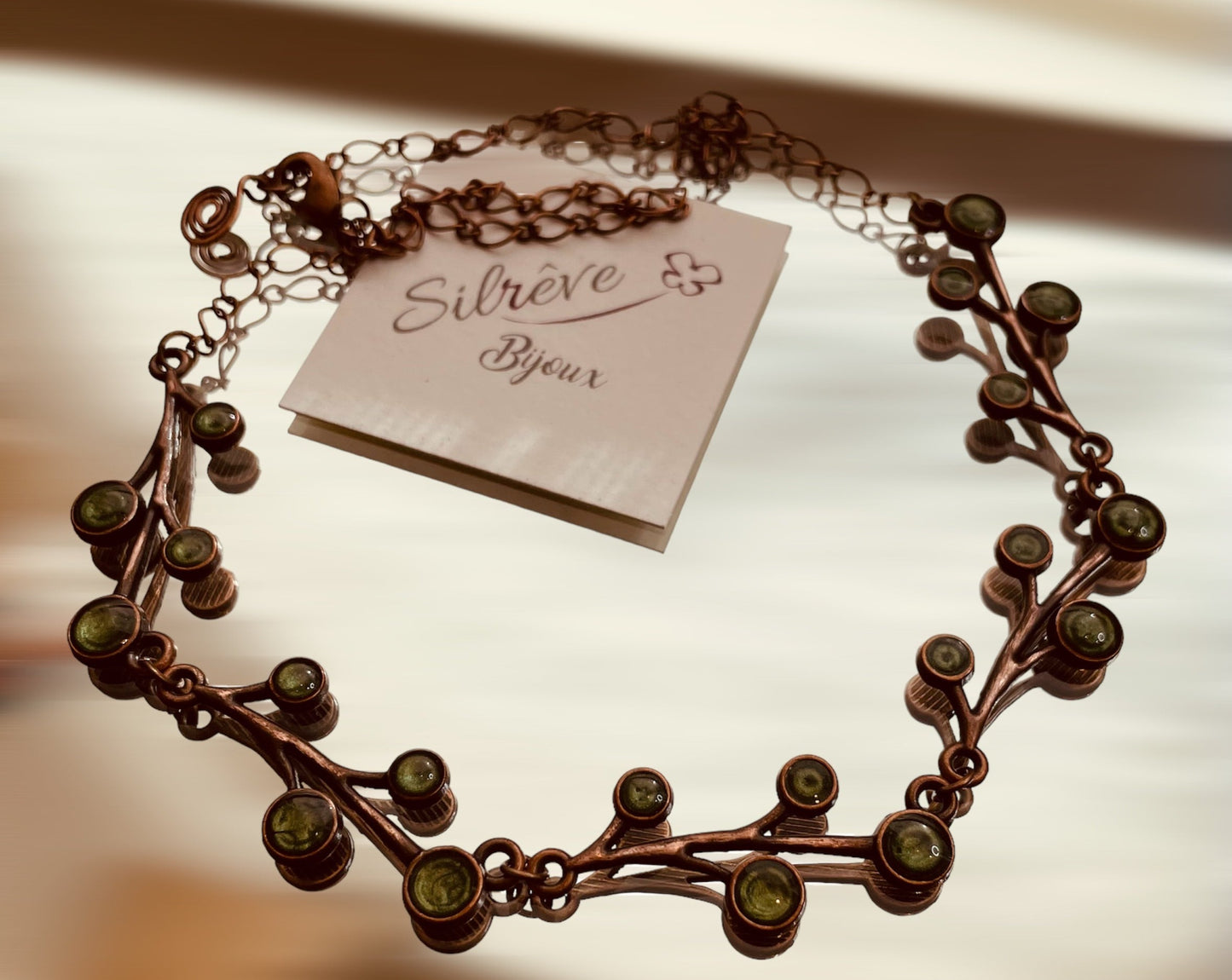 Red copper necklace with floral motifs