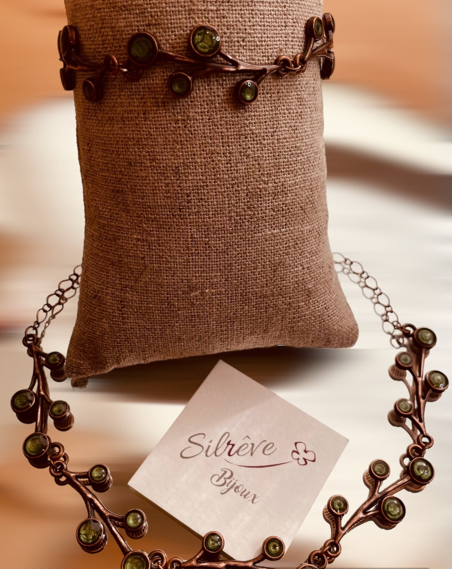 Red copper necklace with floral motifs