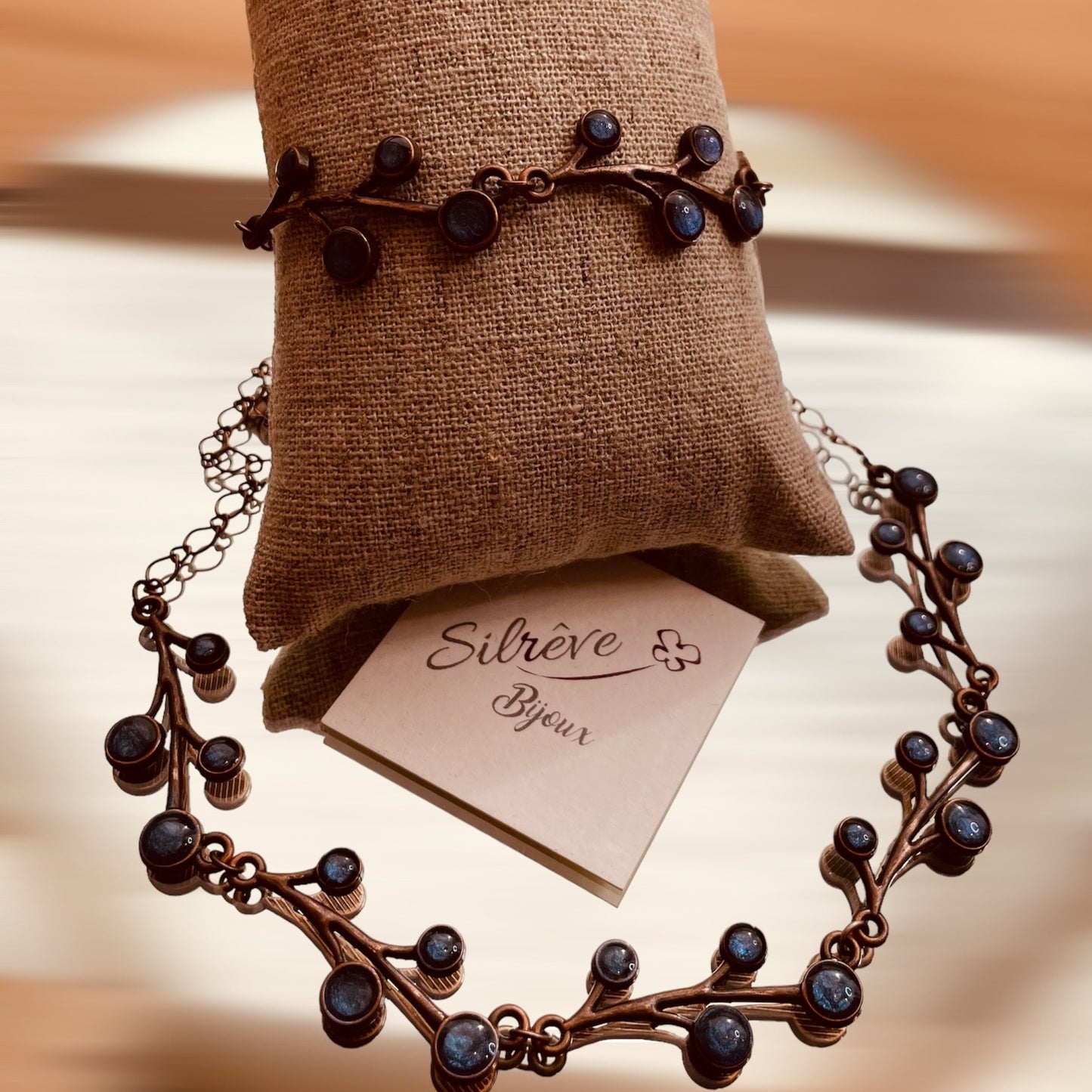 Red copper necklace with floral motifs