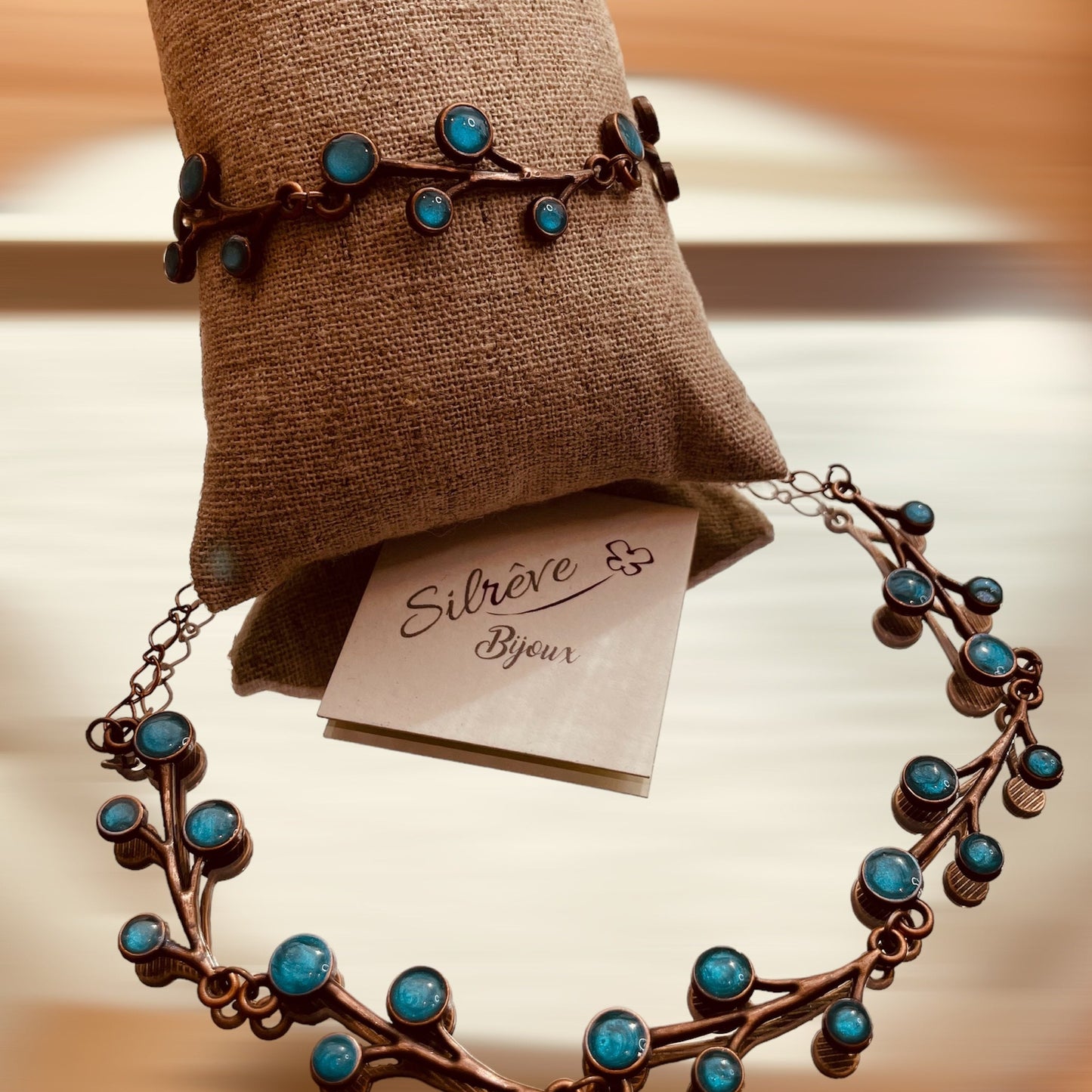 Red copper necklace with floral motifs