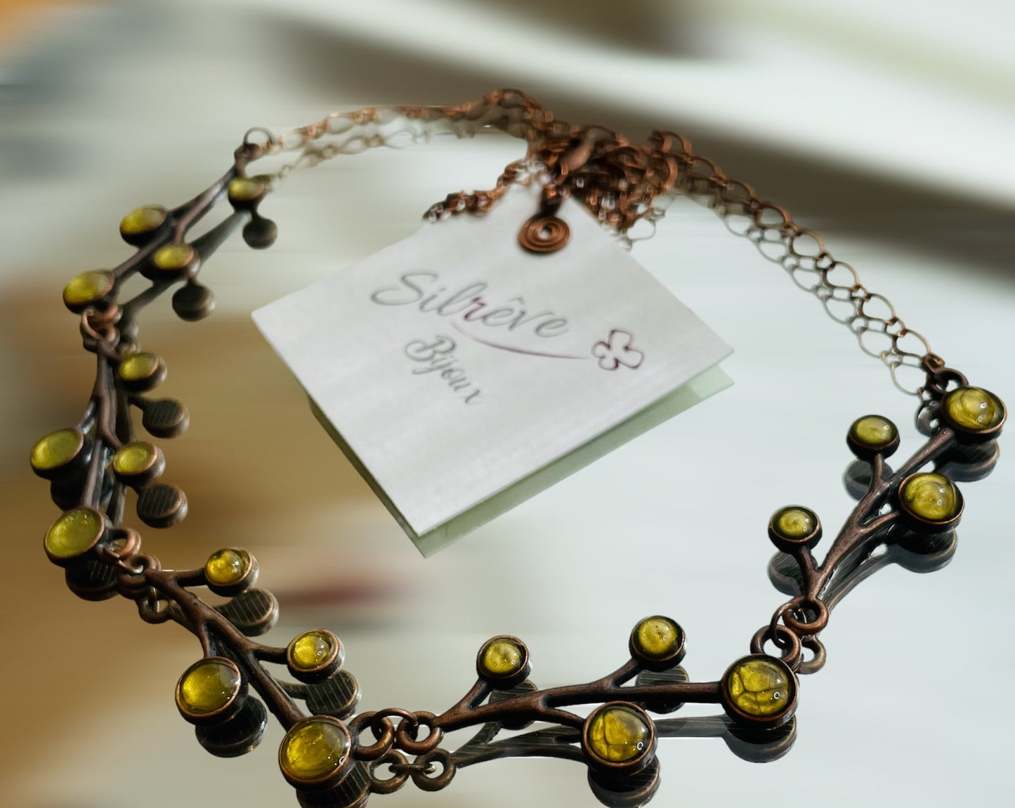 Red copper necklace with floral motifs