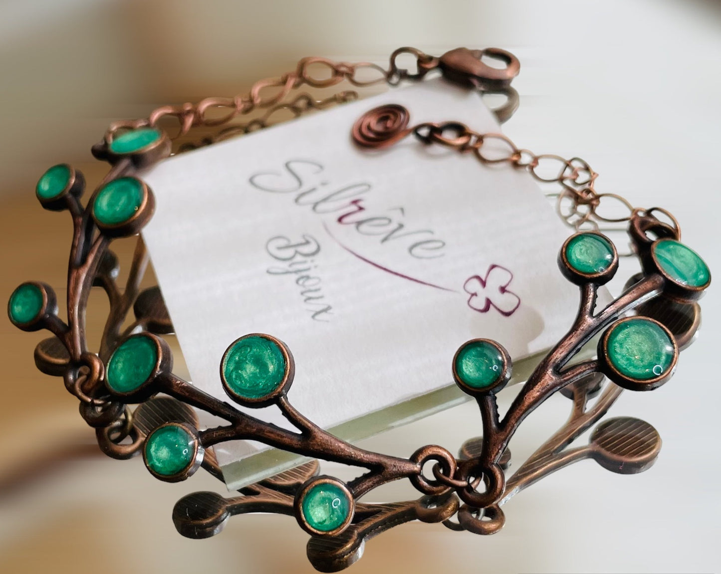 Red copper necklace with floral motifs