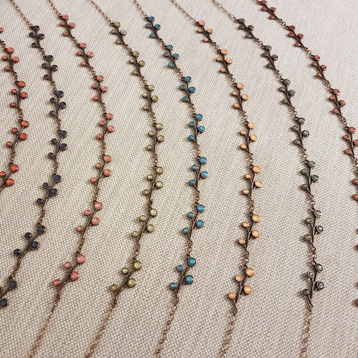 Red copper necklace with floral motifs