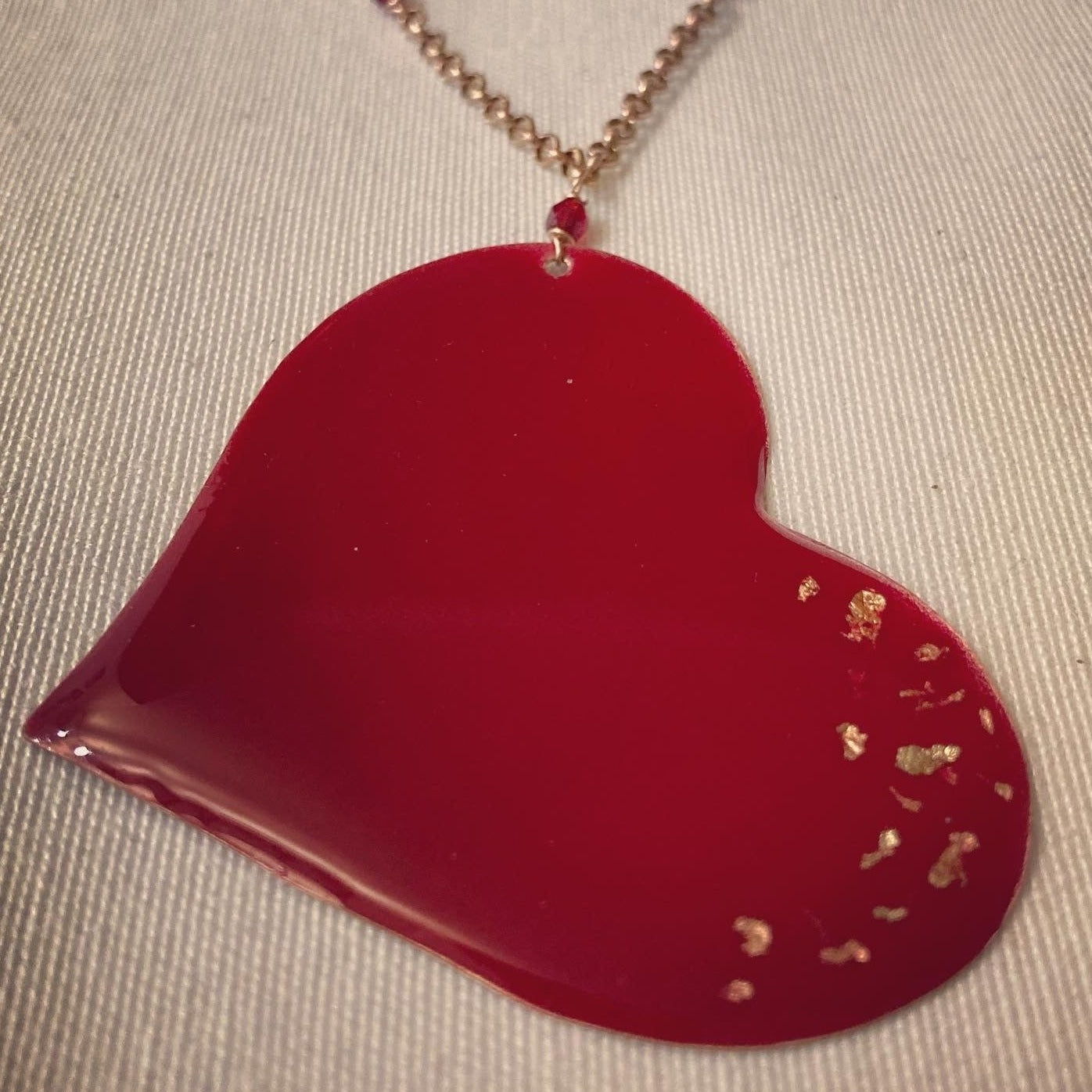 Copper necklace with square pendant, embellished with amethyst pearl.