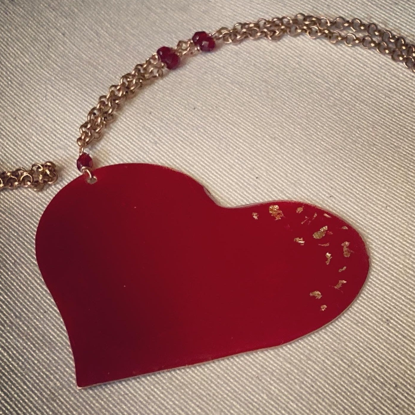 Copper necklace with square pendant, embellished with amethyst pearl.