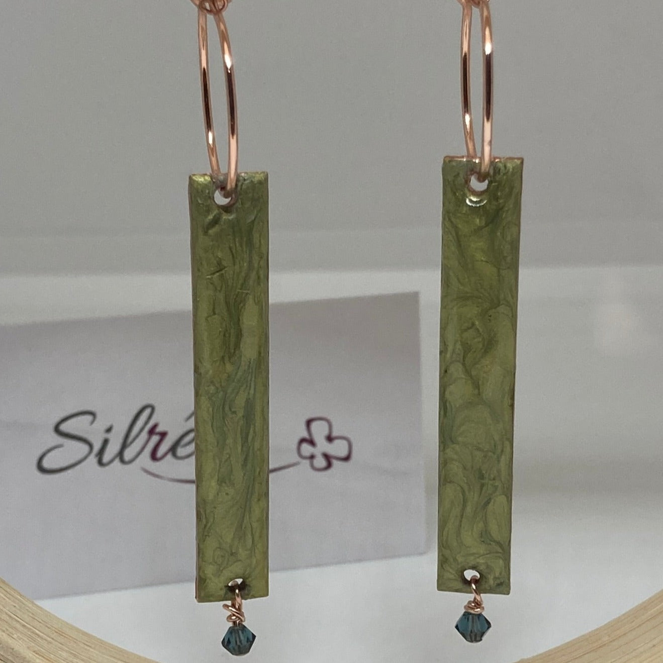 Rectangular red-gold copper earrings, embellished with a small crystal.