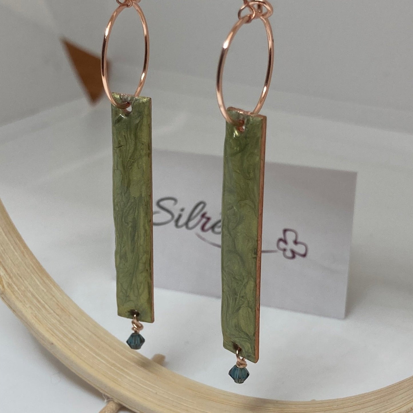 Rectangular red-gold copper earrings, embellished with a small crystal.