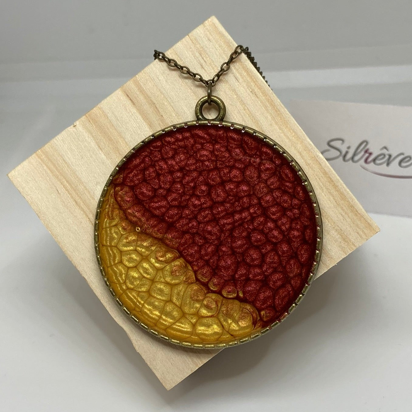 Bronze necklace with hand painted and vitrified round pendant.