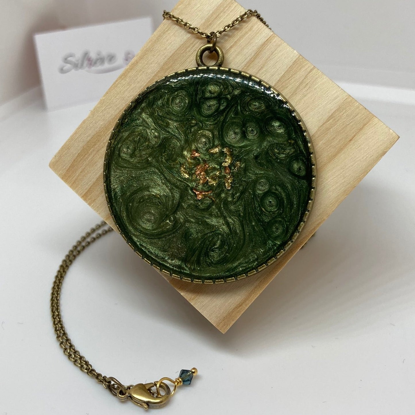 Bronze necklace with hand painted and vitrified round pendant.