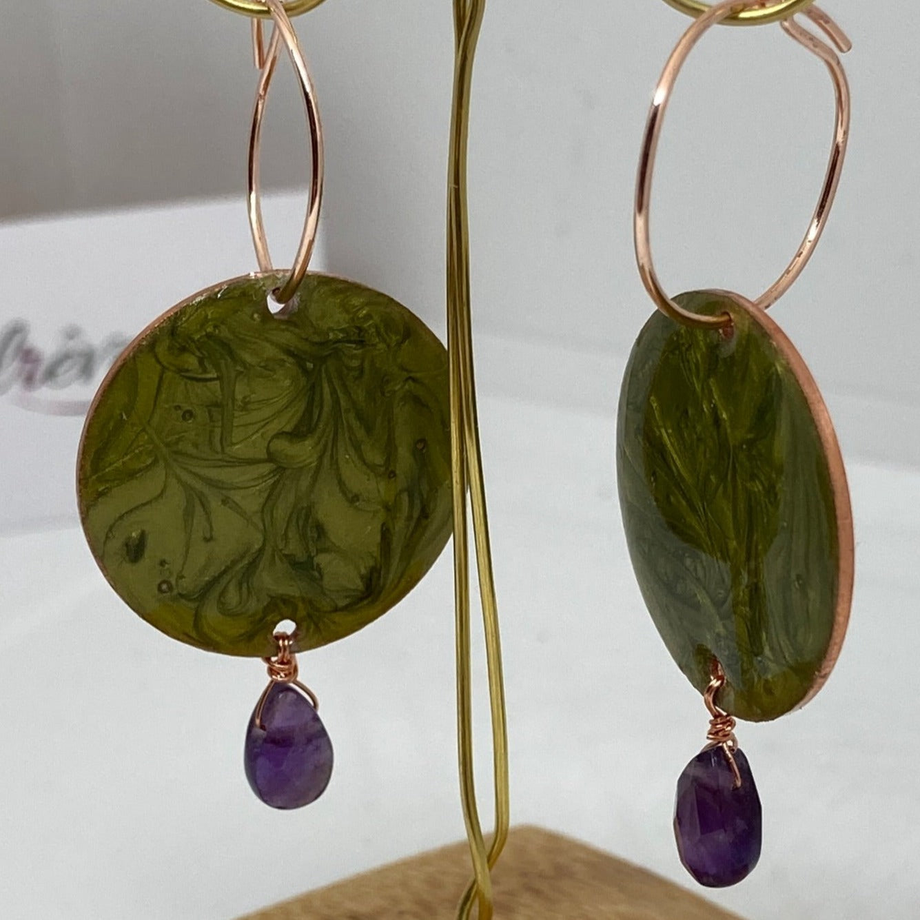 Copper pendant earrings embellished with amethyst drops.