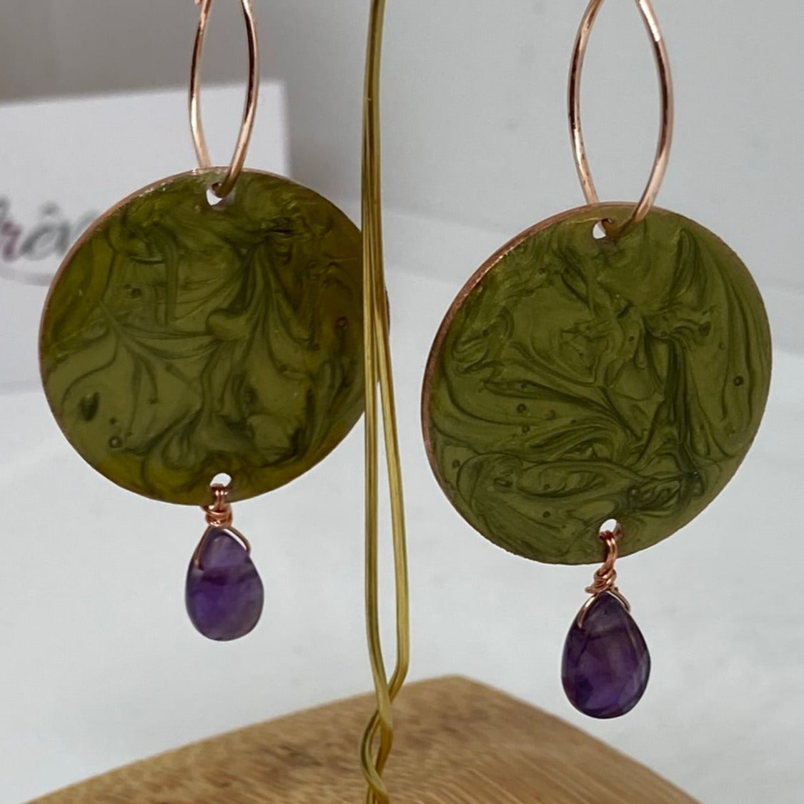 Copper pendant earrings embellished with amethyst drops.