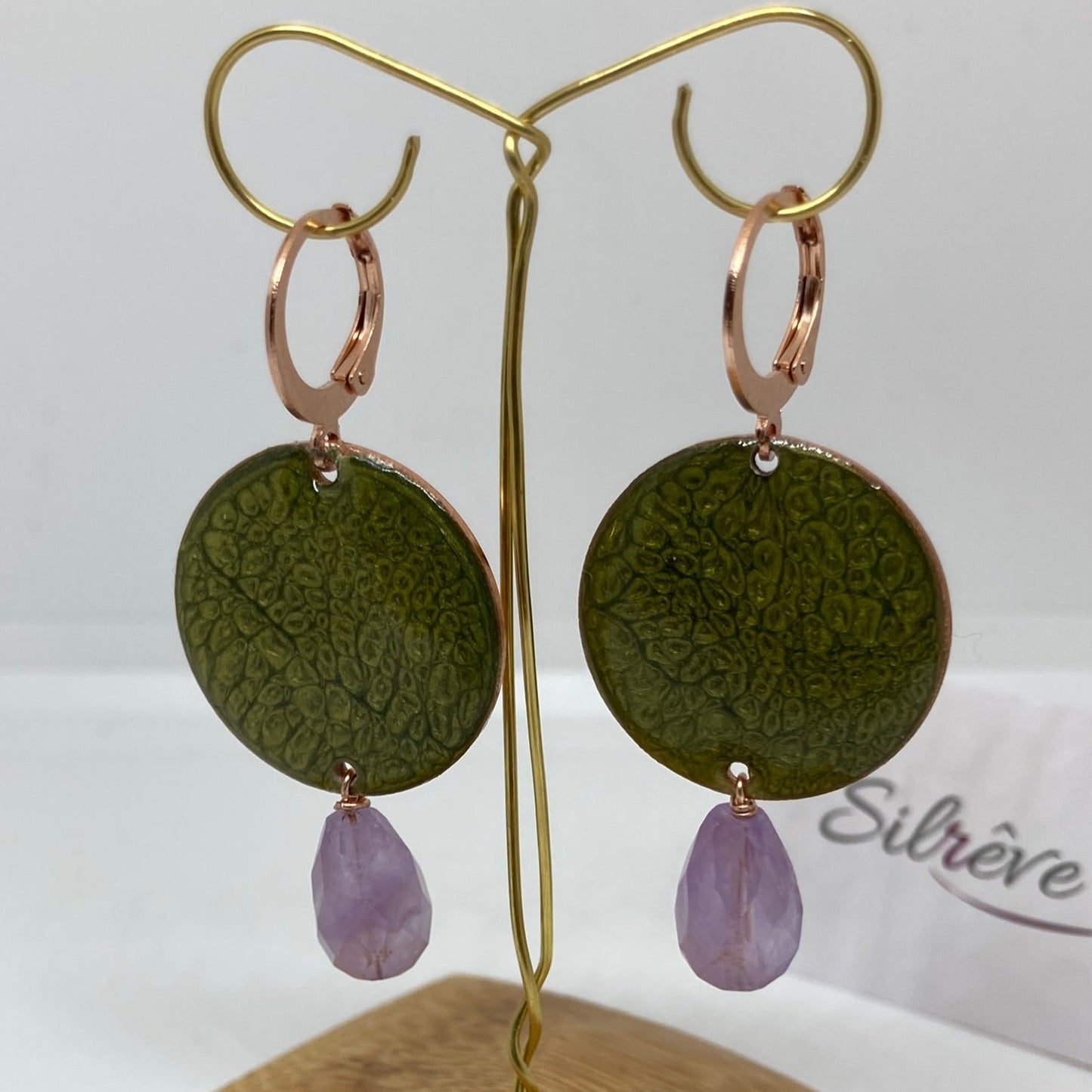 Copper pendant earrings embellished with amethyst drops.