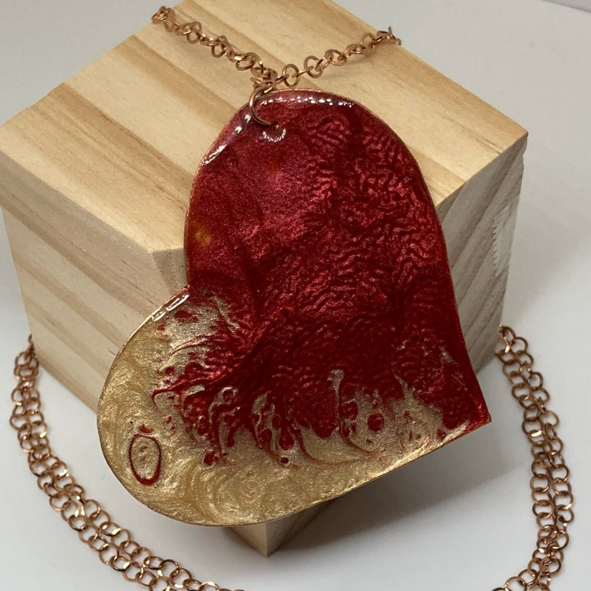 Copper necklace with square pendant, embellished with amethyst pearl.