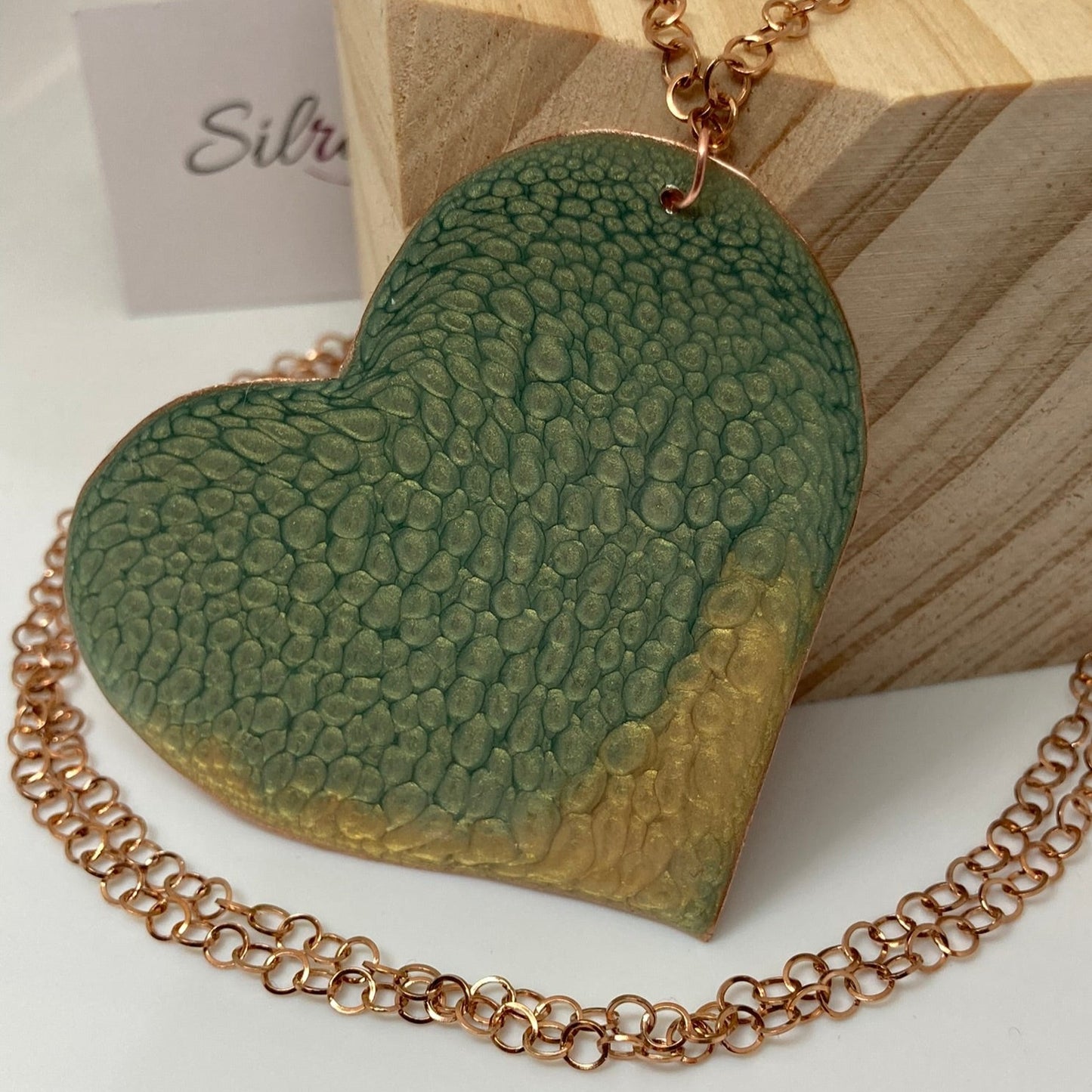 Copper necklace with square pendant, embellished with amethyst pearl.