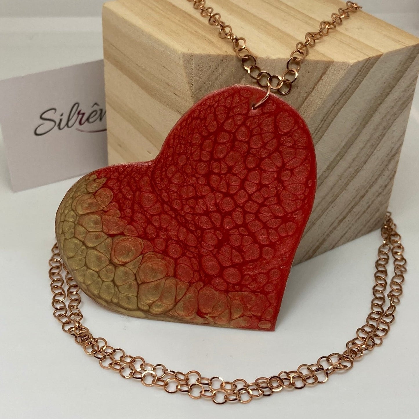 Copper necklace with square pendant, embellished with amethyst pearl.