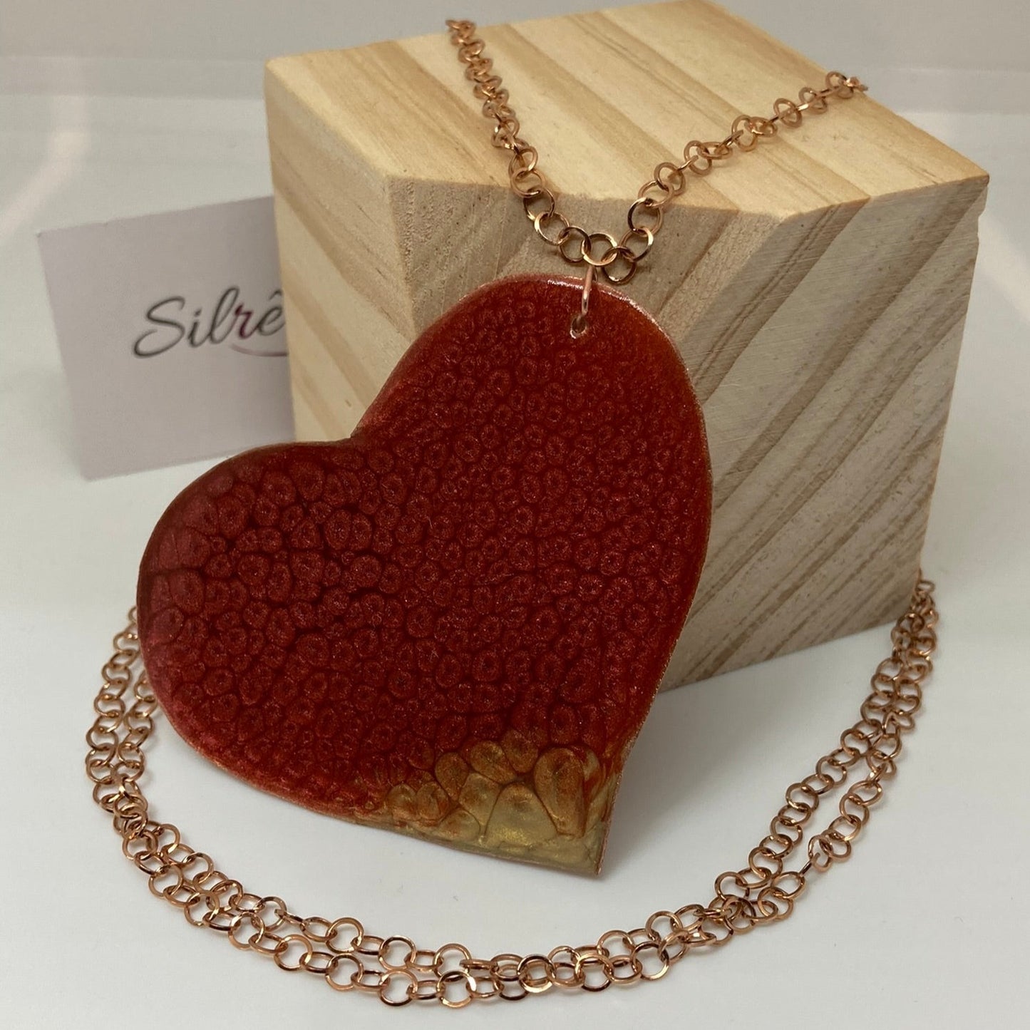 Copper necklace with square pendant, embellished with amethyst pearl.