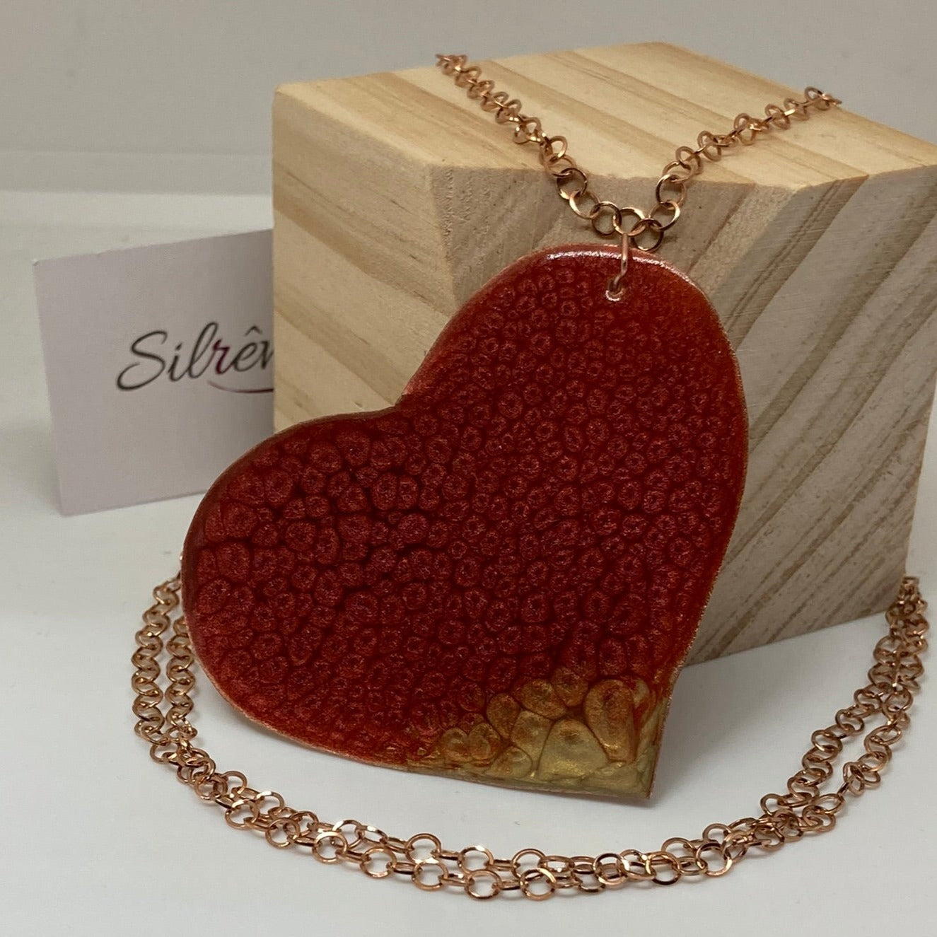 Copper necklace with square pendant, embellished with amethyst pearl.