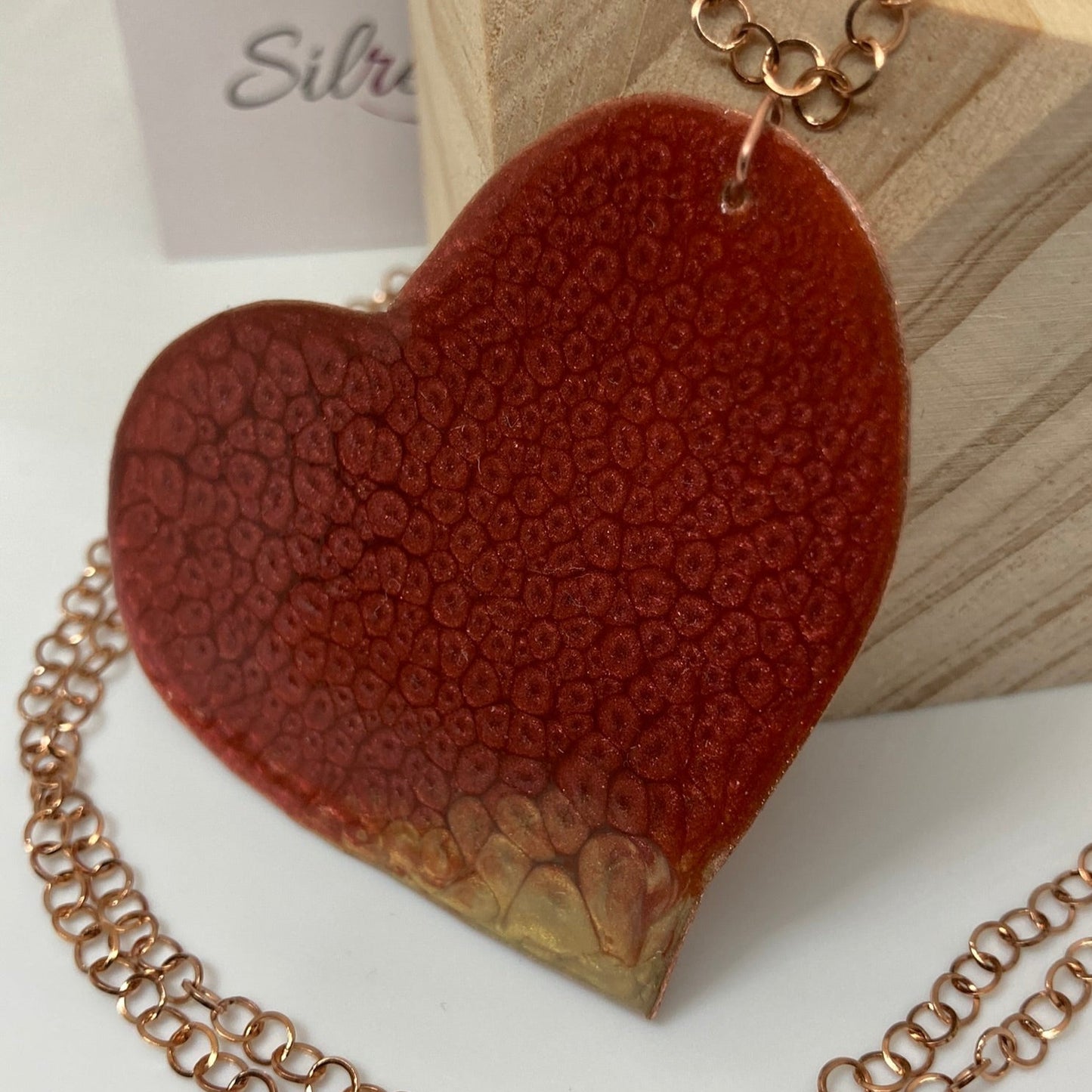 Copper necklace with square pendant, embellished with amethyst pearl.