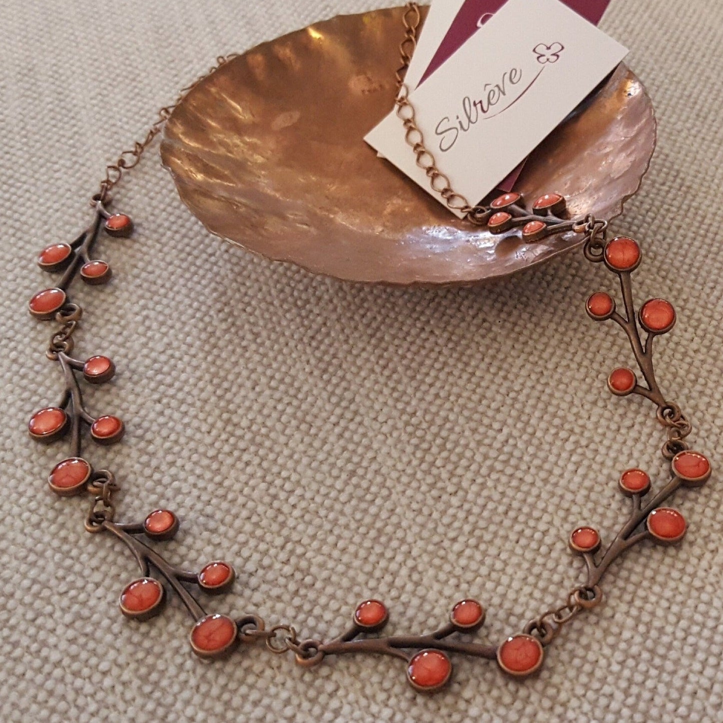Red copper necklace with floral motifs