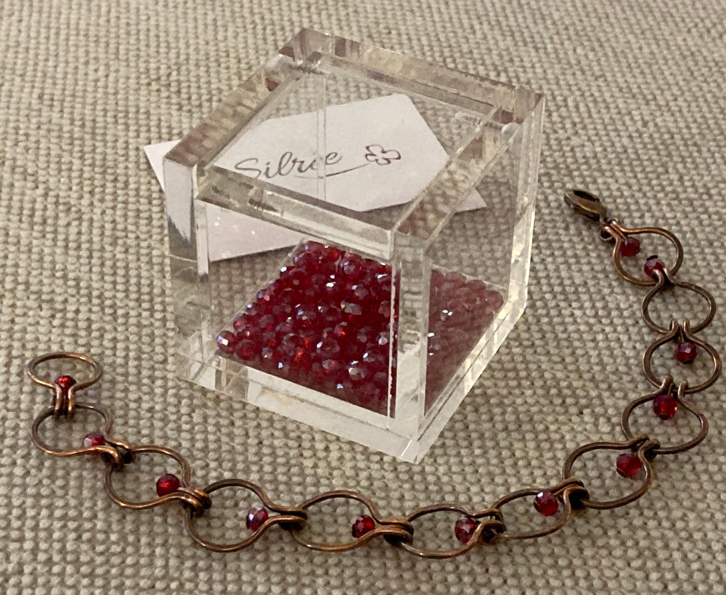 Chain bracelet in hammered copper, antiqued and embellished with small crystals. 1.0cm mesh