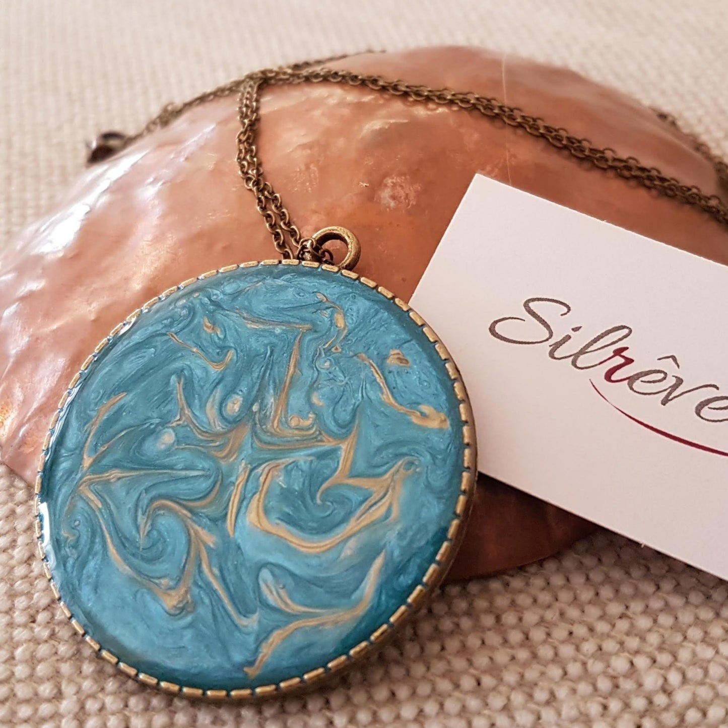 Bronze necklace with hand painted and vitrified round pendant.
