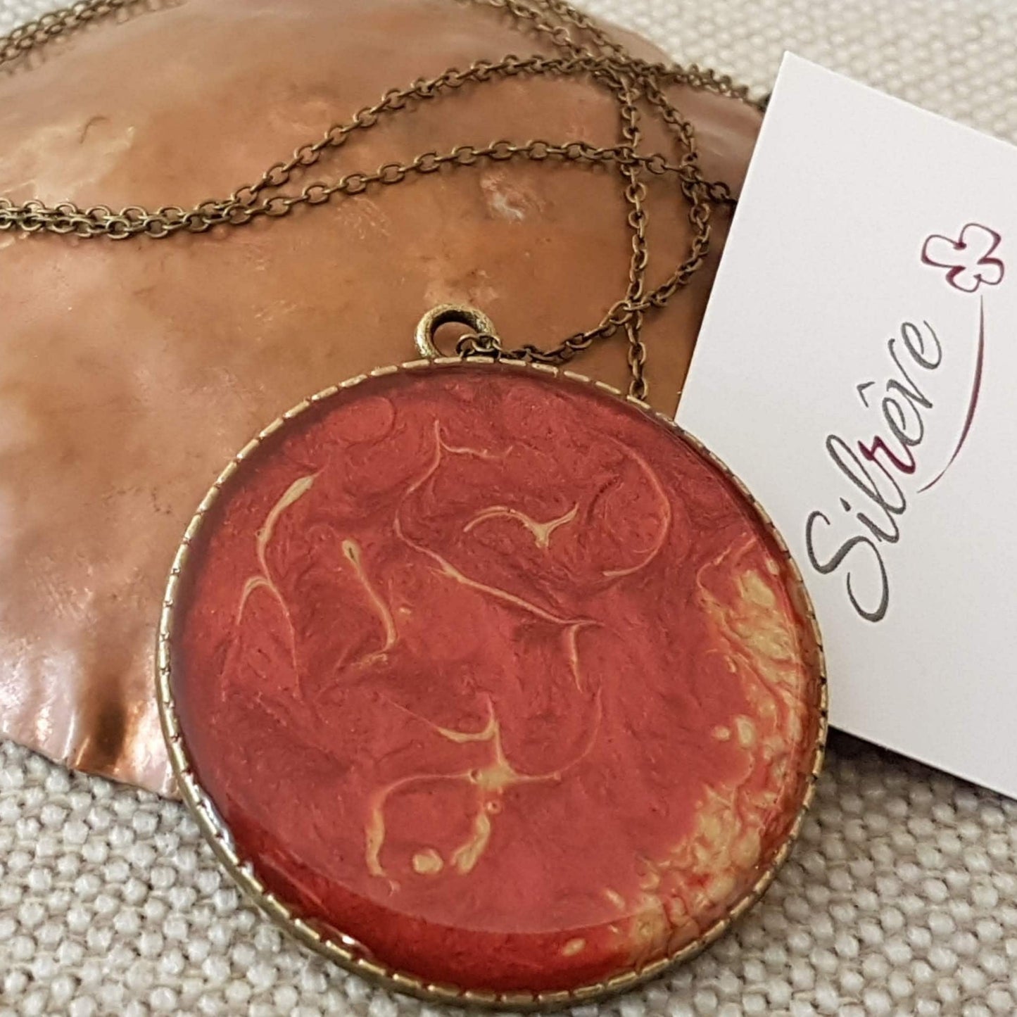 Bronze necklace with hand painted and vitrified round pendant.