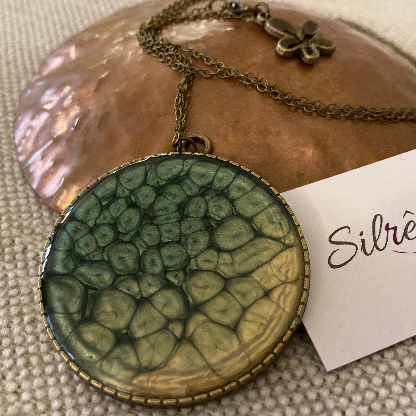 Bronze necklace with hand painted and vitrified round pendant.