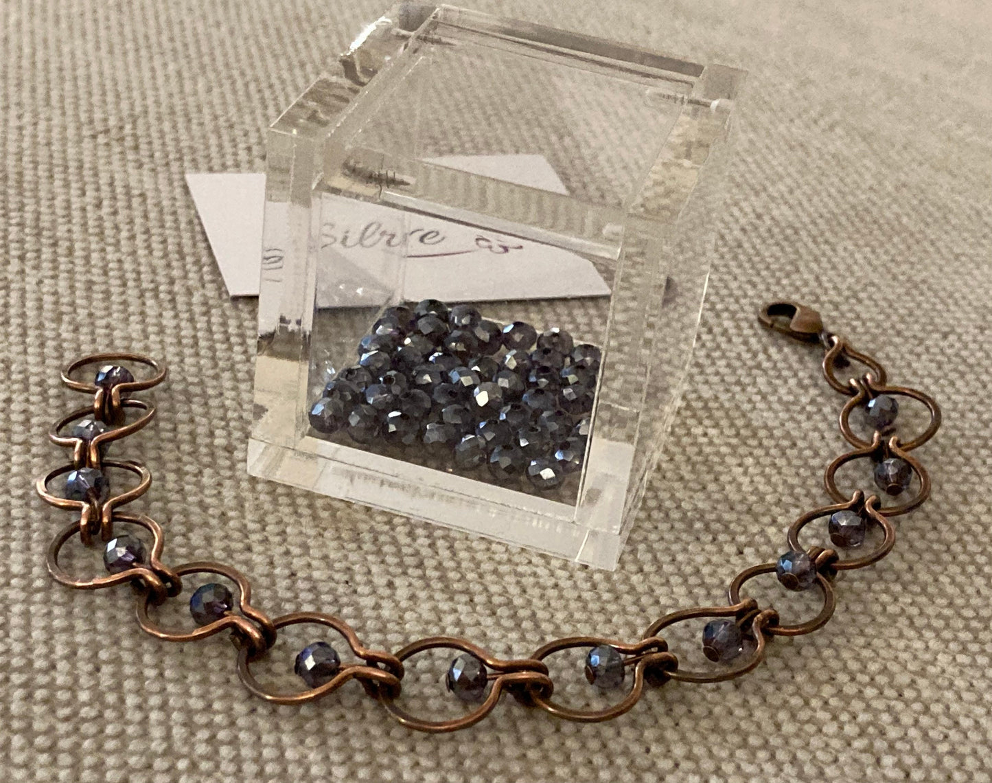 Chain bracelet in hammered copper, antiqued and embellished with small crystals. 1.0cm mesh