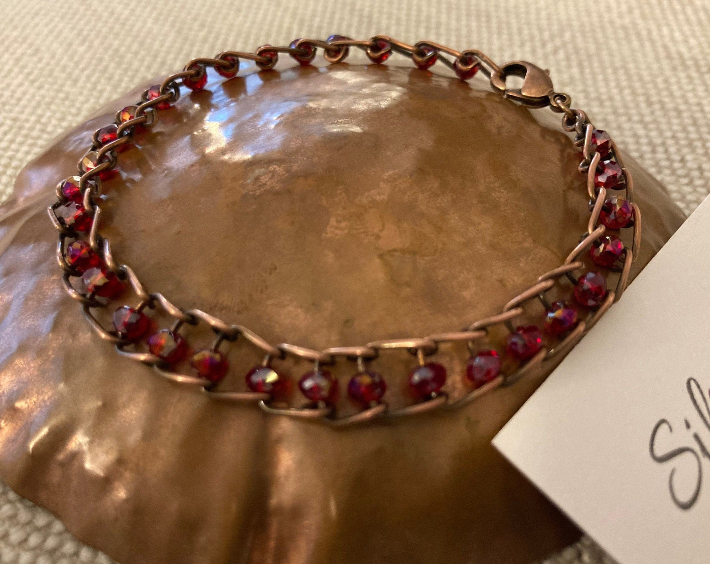 Antiqued copper bracelet, embellished with small crystals