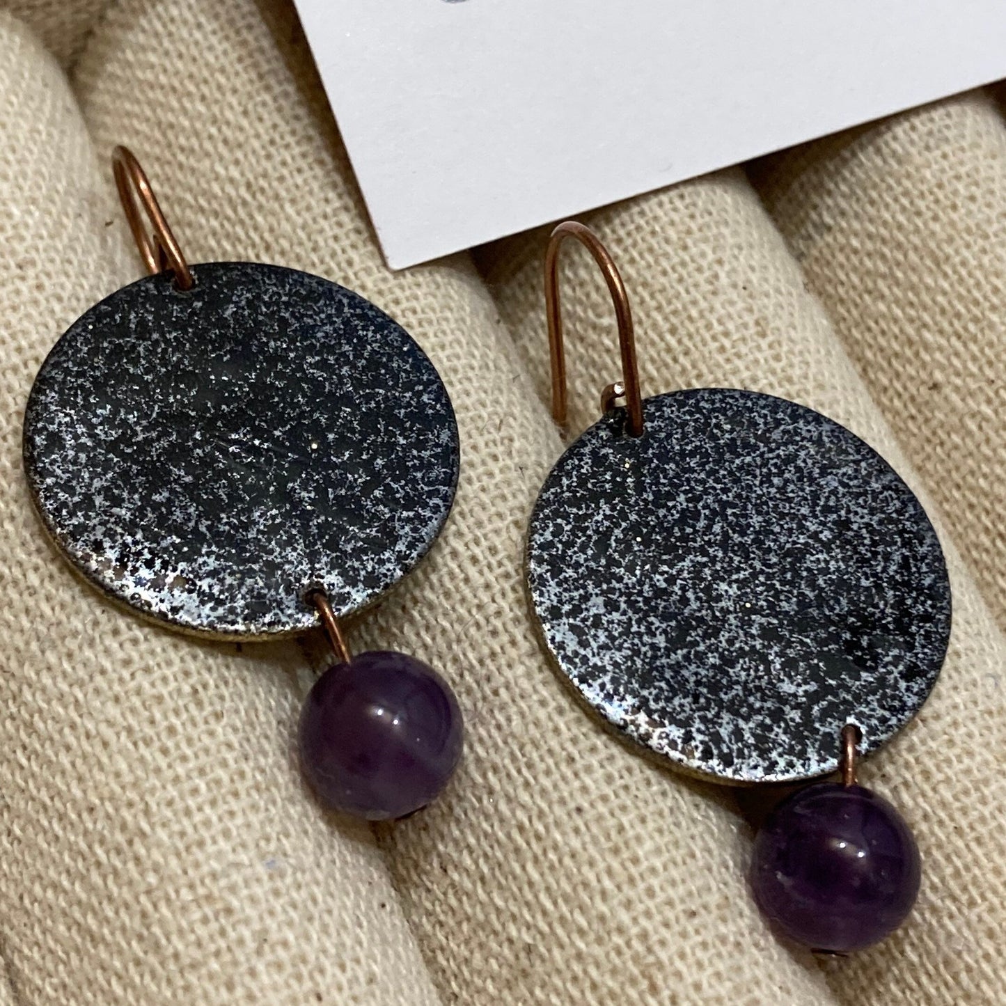 Antiqued copper earrings, hammered effect, with amethyst pearl.