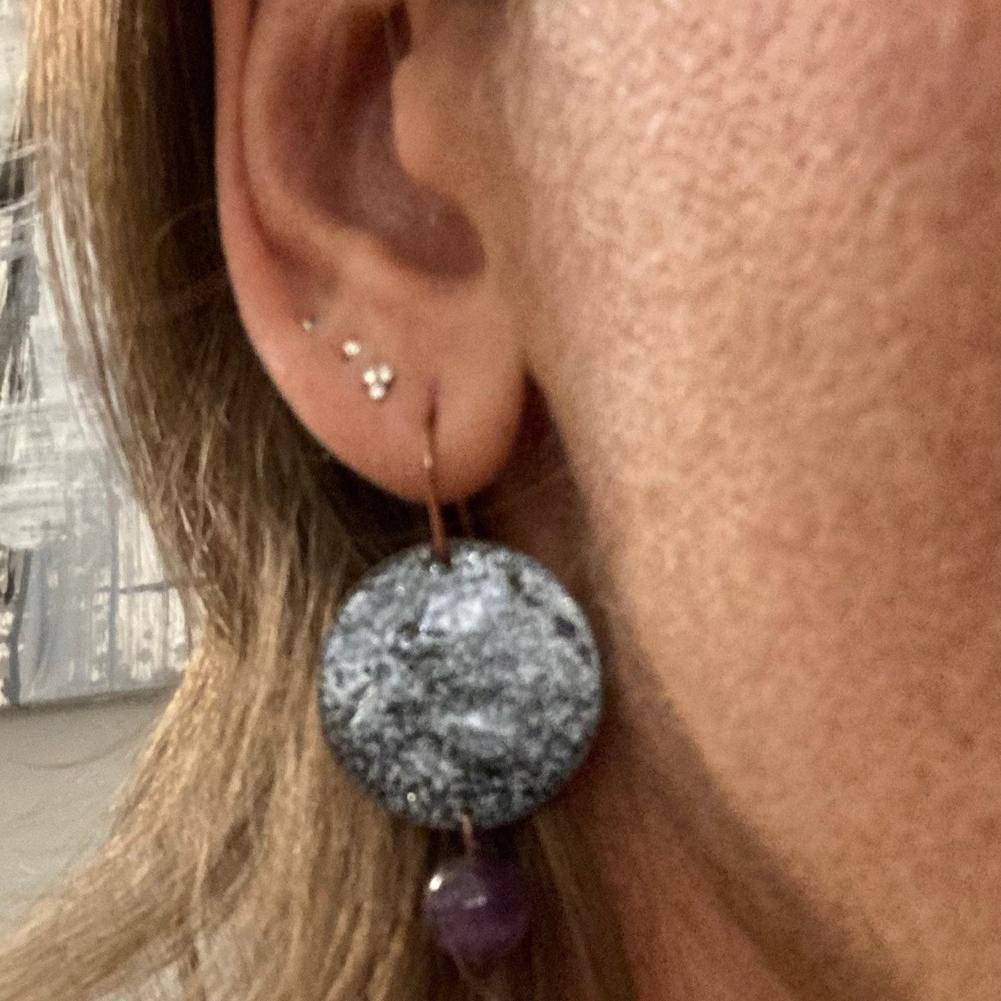 Antiqued copper earrings, hammered effect, with amethyst pearl.